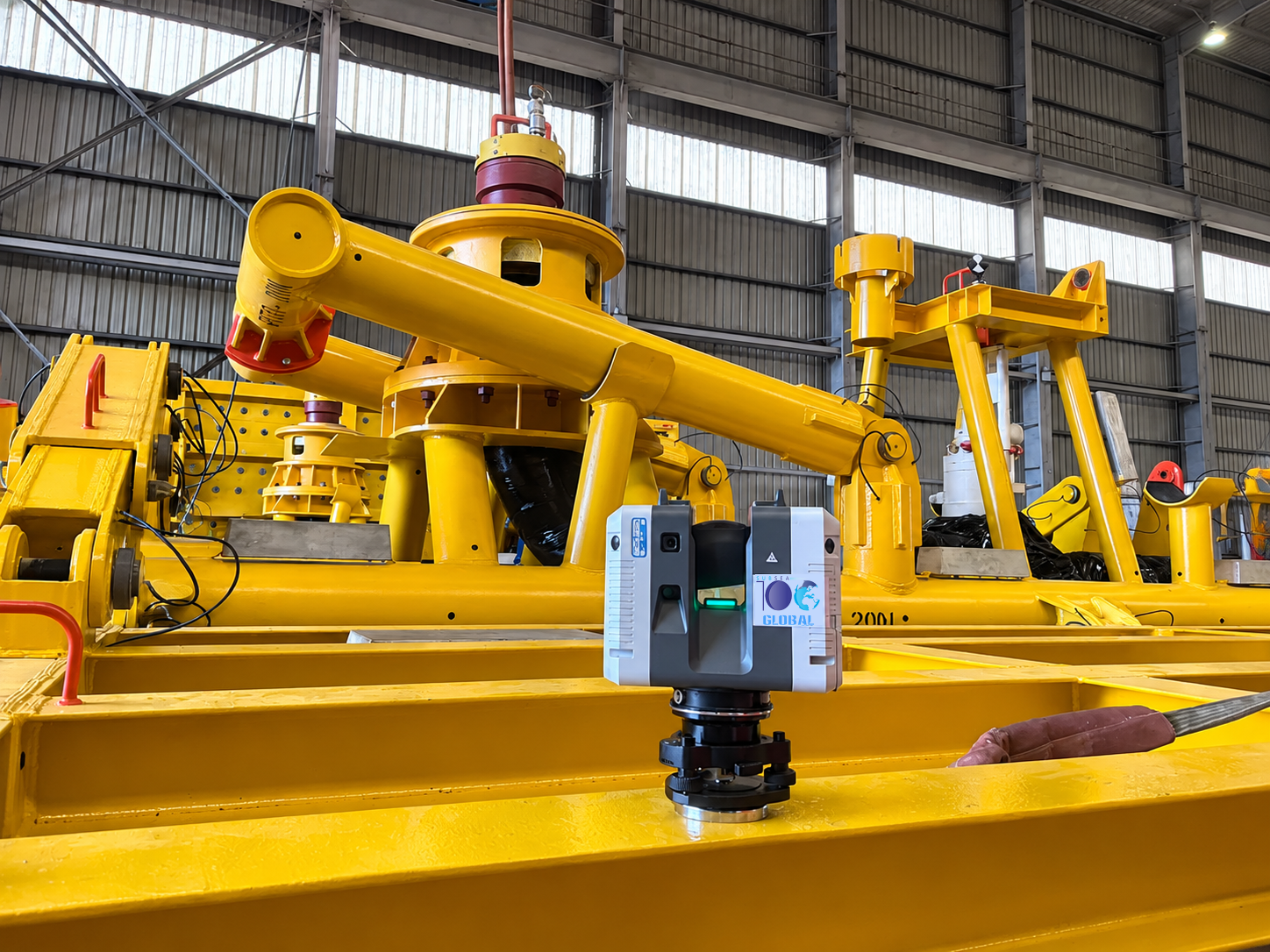 Subsea100-branded laser scanner capturing a yellow subsea structure in the fabrication yard